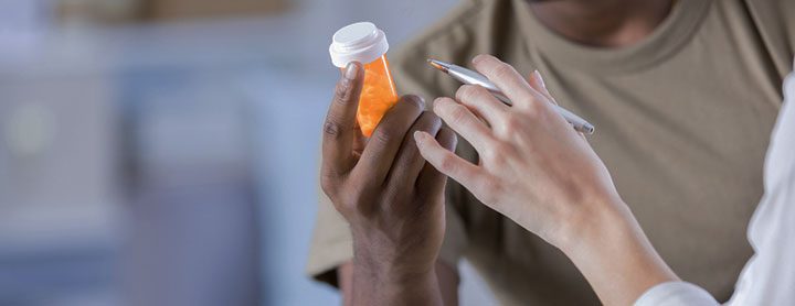 Doctor explaining medication to military patient