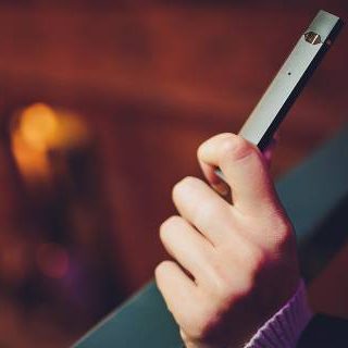 Girl holding e-cigarette
