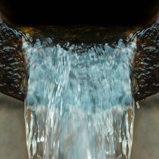 Water flowing from rusted pipe