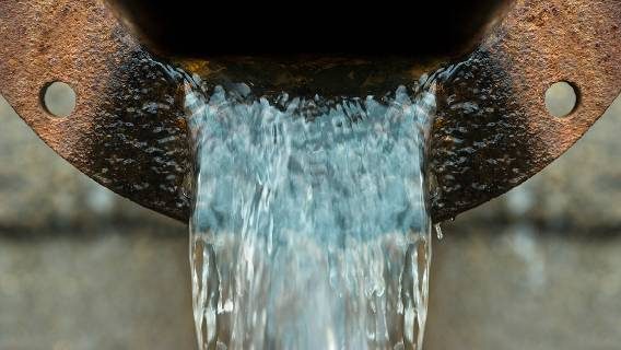 Water flowing from rusted pipe