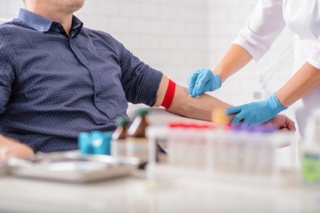 Man Getting Blood Drawn in Lab