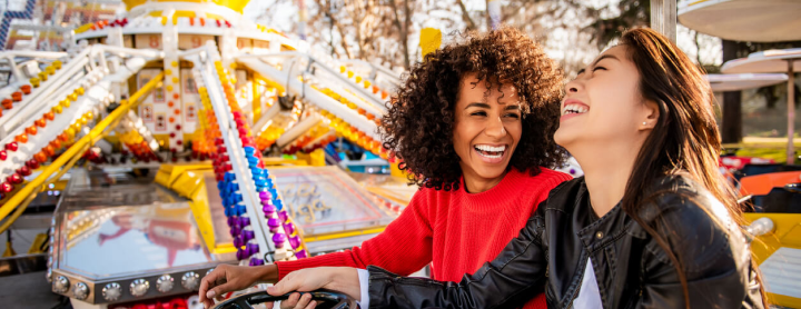 Women enjoying a fair ride