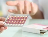 people handling birth control pills