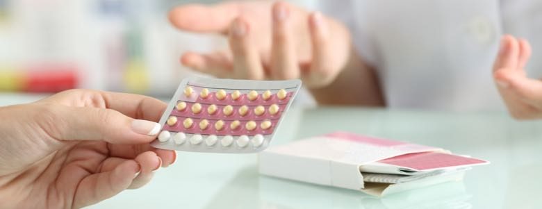 people handling birth control pills