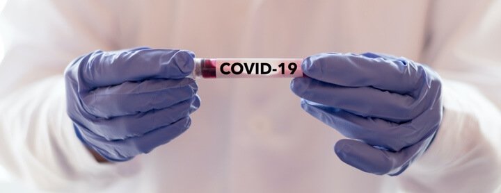 Doctor holding a COVID-19 vaccine