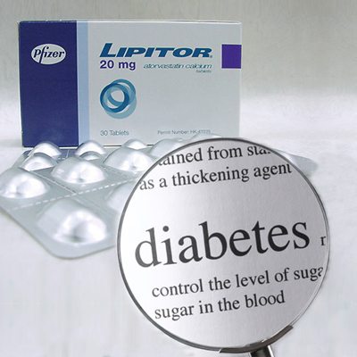 Lipitor may increase diabetes risk Lipitor box and pills with the word "diabetes" under a magnifying glass