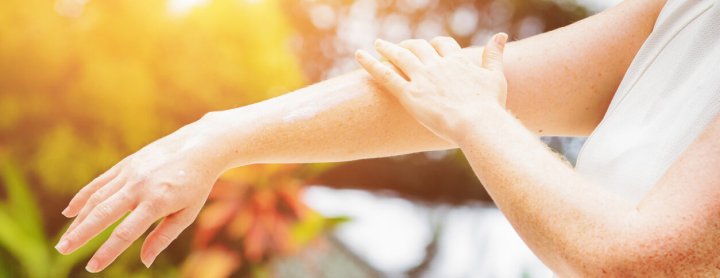 Person checking the skin on their arm for burns