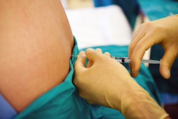Person receiving benzocaine injection