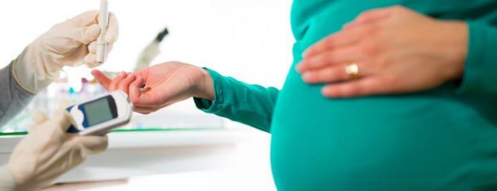 Pregnant woman taking a prick test