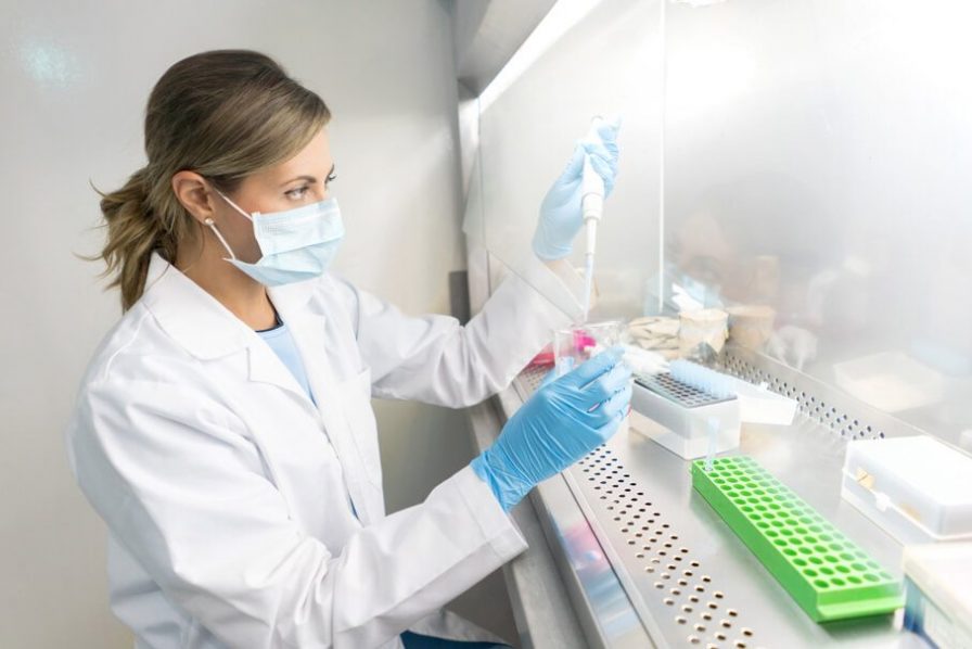 Woman Testing Chemicals in Lab
