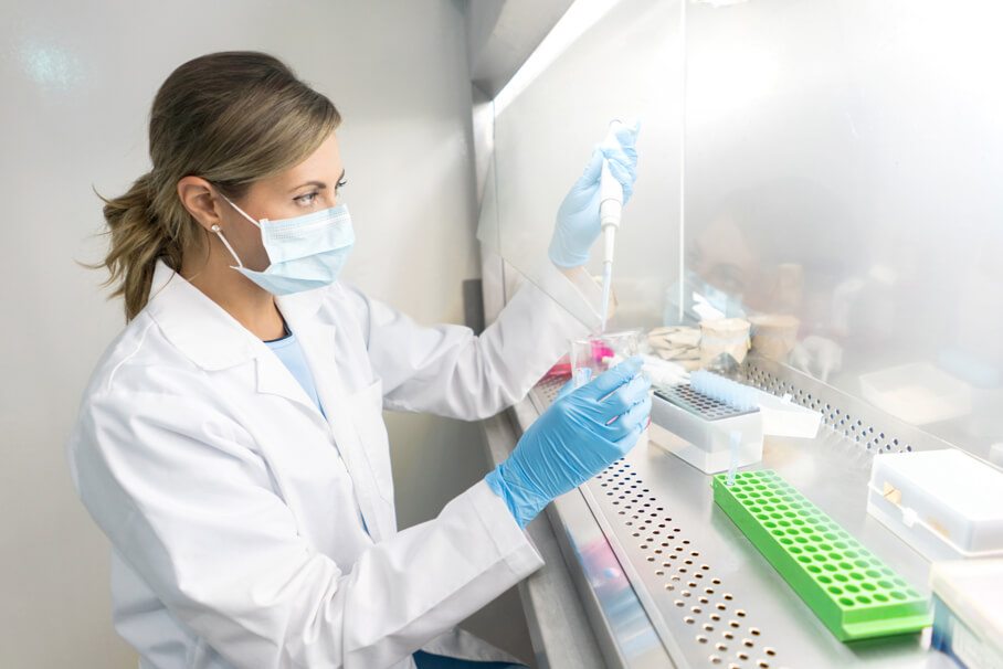 Woman Testing Chemicals in Lab