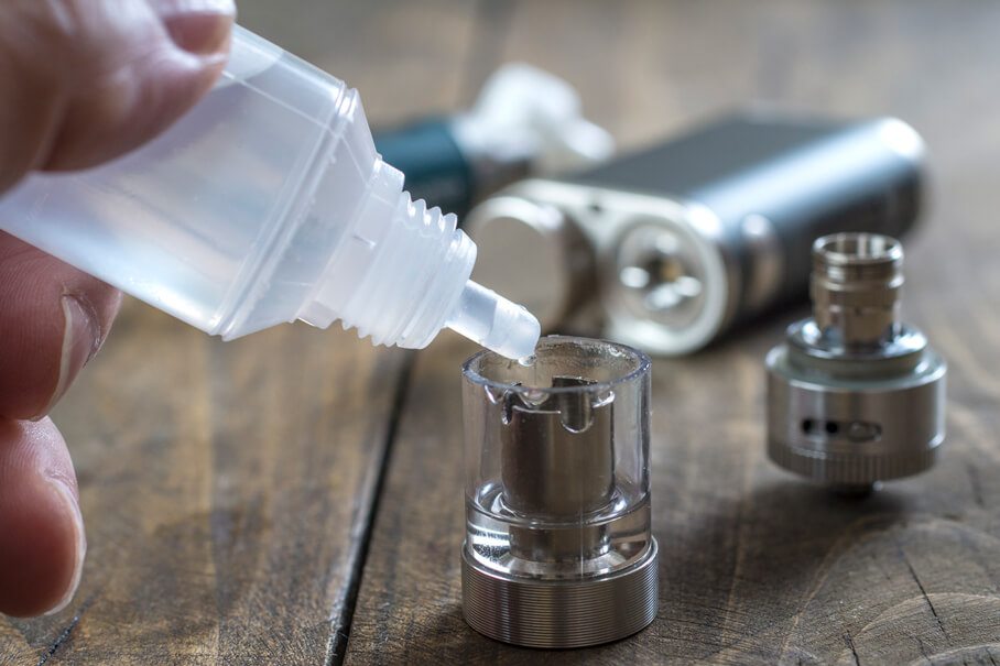 E-Cigarette Liquid Being Poured into Chamber