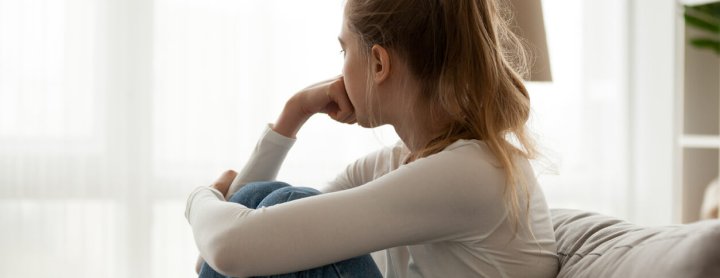 Girl staring out window