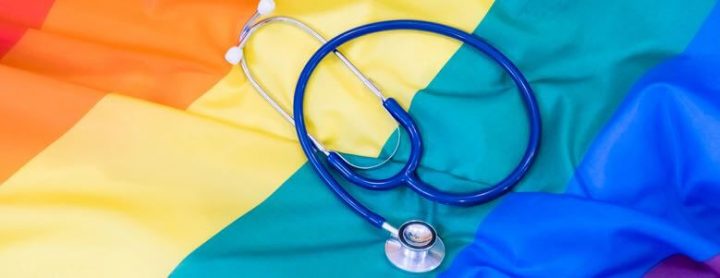 lgbtq rainbow flag and stethescope