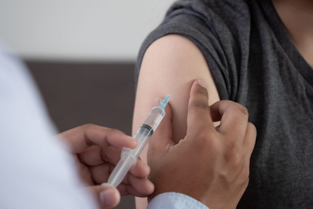 Doctor giving patient vaccine insulin or vaccination