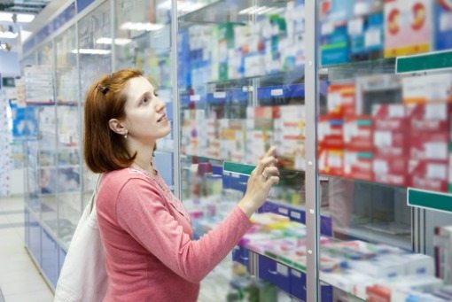 woman in pharmacy woman shopping in pharmacy